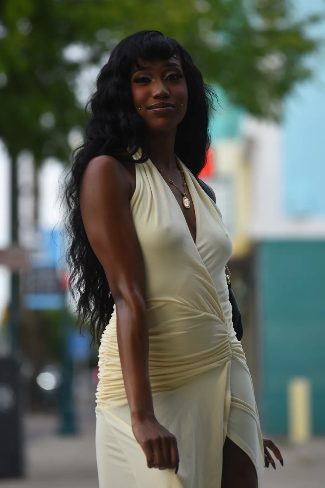 Model in a cream halter dress under palm trees, Roseville / Sacramento area 2026